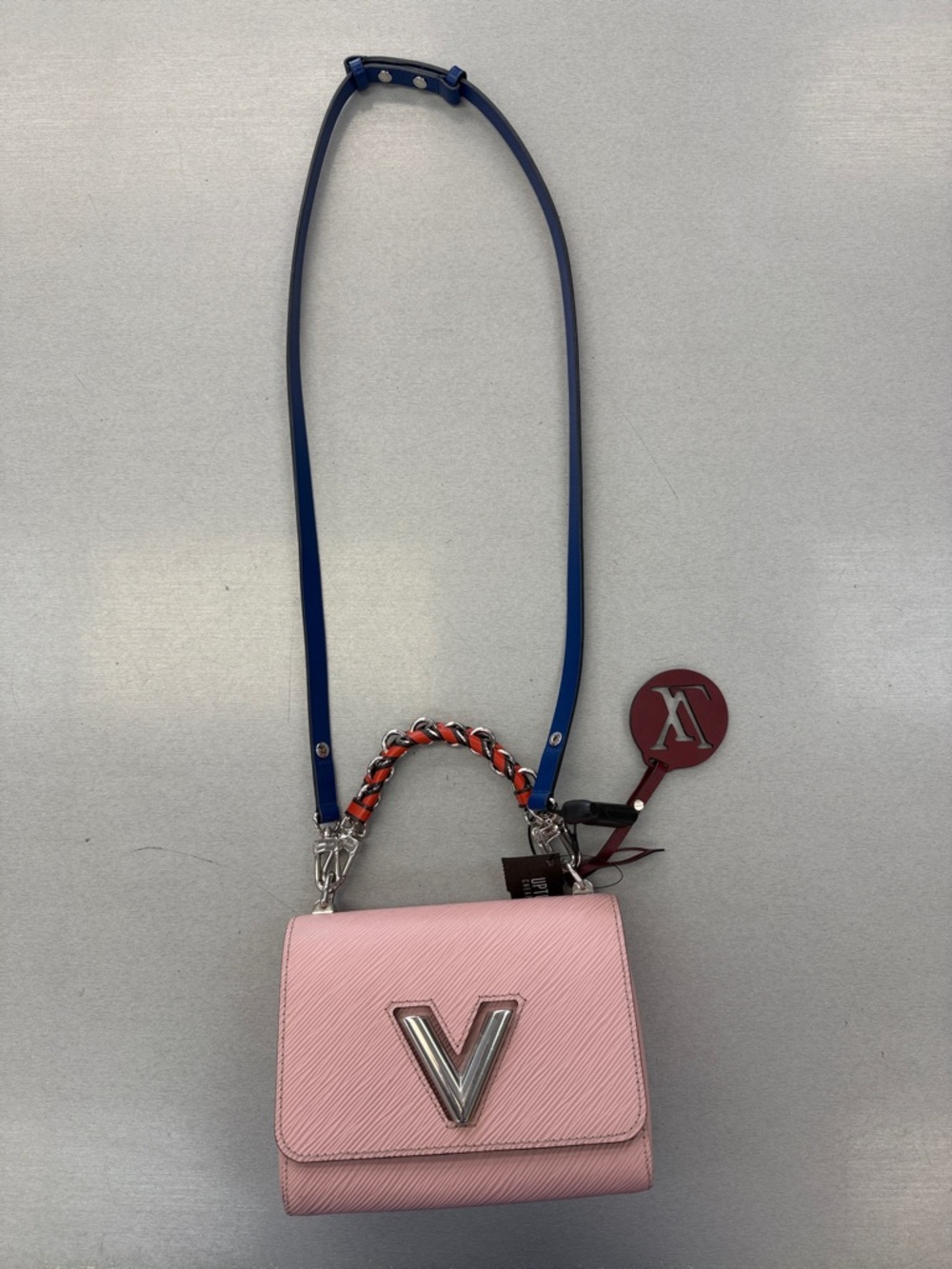 Louis Vuitton Pink Crossbody Bag with Silver 'V' Accent